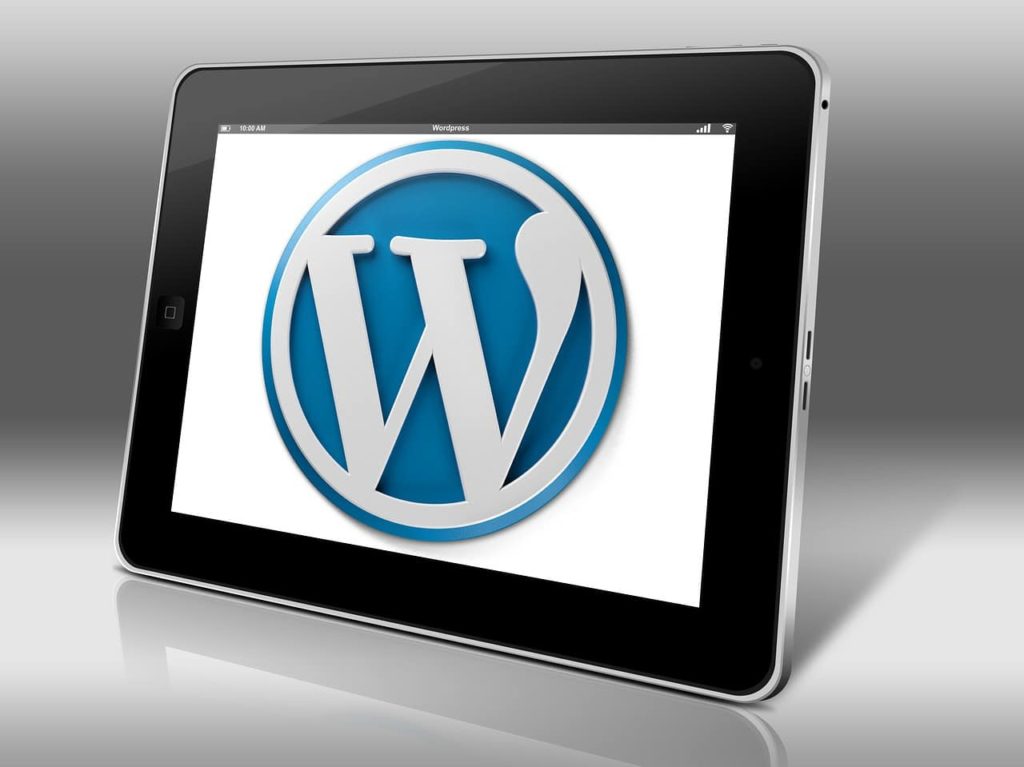 Image of WordPress logo on tablet screen - update your WordPress website